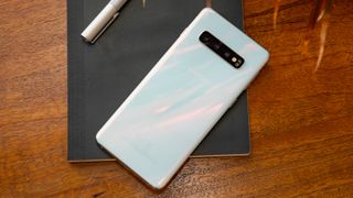 A Samsung Galaxy S10 in white, from the back