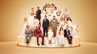 The contestants for Married at First Sight UK season 9 pose on a giant wedding cake, dressed in wedding attire